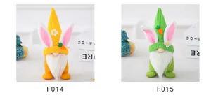 Detail of yellow and green Easter gnomes with rabbit ears, flowers and carrots