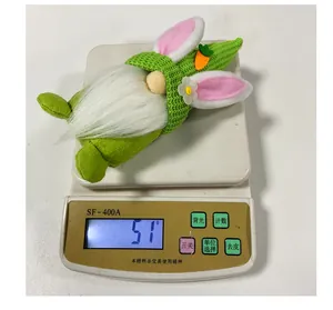 Easter gnome plush weight measurement showing 51g on a digital scale closeup