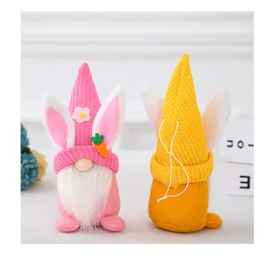 Detail of Easter gnomes plush with bunny ears, carrot charms, and white fiber beards