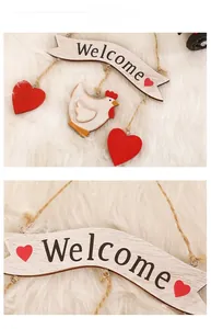 Detail of wooden Easter welcome sign with hanging chicken and red heart ornaments