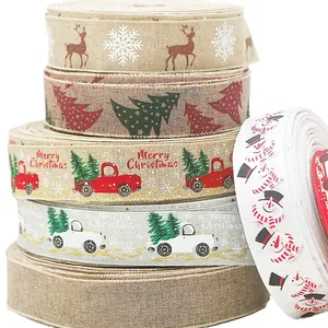 Five rolls of burlap Christmas ribbons with reindeer, snowman, and truck patterns