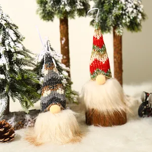 Lighted Christmas gnome plush set with knitted hats and furry beards in a forest scene
