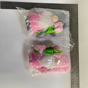 Detailed view of handmade gnome plush dolls with tulips measuring approximately 25cm