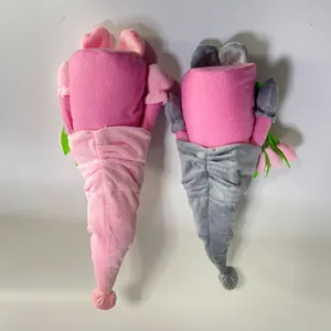 Detail of plush gnome doll set with tulip bouquet in soft pink and grey velvet fabric