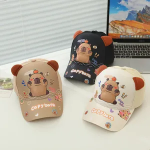 Detailed close-up of kids' capybara baseball caps in khaki, black and beige colors