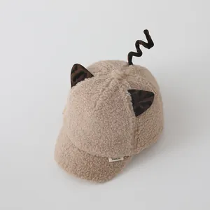 Detail of warm beige plush baseball cap with fuzzy lamb wool texture and cute animal ears