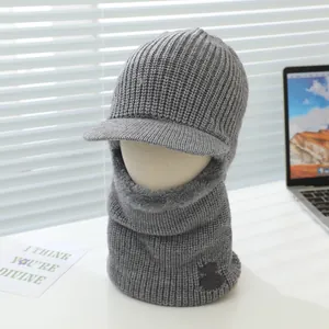 Detail of grey knitted winter balaclava with warm fleece lining and integrated neck gaiter