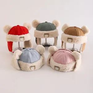 Winter plush bear earflap hats for kids in multiple colors with cute pom-pom details