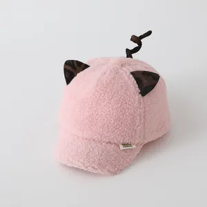 Close-up of pink fleece kids baseball cap with leopard ears and DIDICute label