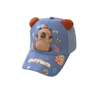 Kids blue baseball cap with cartoon capybara prints and 3D plush ears on white background