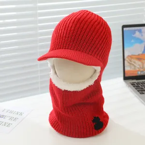 Detail of red winter knit hat with fleece lining and ear protection for outdoor warmth