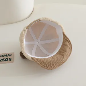 Detailed interior view of baby baseball cap showing corduroy brim and faux lamb wool fabric