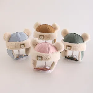 Detailed view of warm winter earflap hats for kids in four colors with faux fur lining