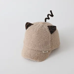 Detailed macro view of the soft fleece baby baseball cap with leopard print animal ears