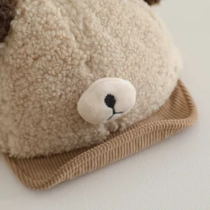 Close-up of soft lamb wool baby baseball hat with cute 3D bear ears and plush fabric