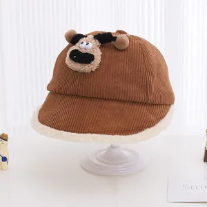 Detail of children's brown corduroy hat with plush puppy face and warm fleece lining