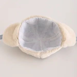 Detailed interior of winter plush hat showing breathable blue fabric lining and warm earflaps