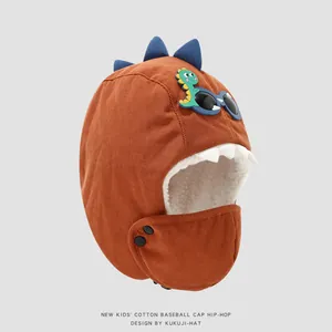 Detail of warm rust-red corduroy dinosaur aviator hat with fleece lining for kids