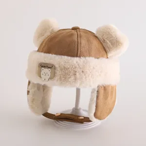 Detail of winter trapper hat for kids featuring plush bear ears and warm fleece lining