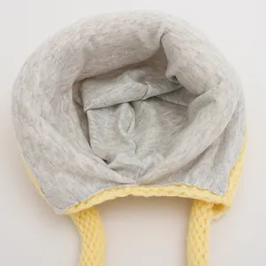 Winter infant knit hat with bright yellow yarn, soft grey lining and chin straps