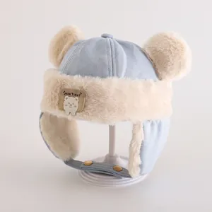 Detail of winter trapper hat for kids with soft faux fur lining and bear ears