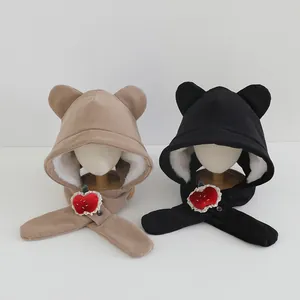 Detail of plush fleece lining and cute bear ears on children's winter trapper hat