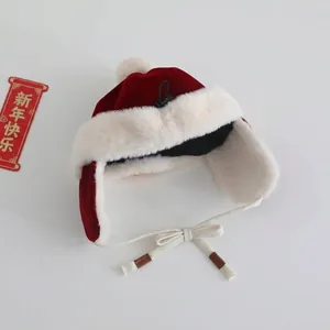 Red winter baby trapper hat with white fur trim and pompom for festive warmth