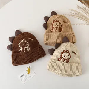 Cozy knit kids winter hats featuring cartoon dinosaur spikes and warm cuff design