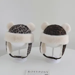 Detail view of leopard print baby winter hat with plush bear ears and warm ear flaps