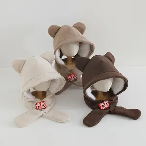 Close-up of corduroy kids winter hats with bear ears and lion dance embroidery patches