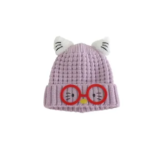 Purple knitted kids hat with white plush ears, cartoon cat face and red glasses