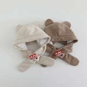 Close-up of children's plush lined earflap hat with traditional lion dance embroidery