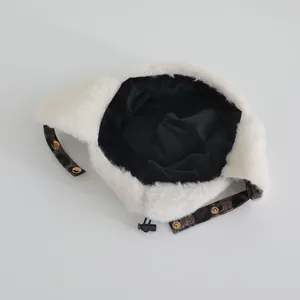 Detail of baby winter hat featuring plush faux fur lining and leopard print ear straps