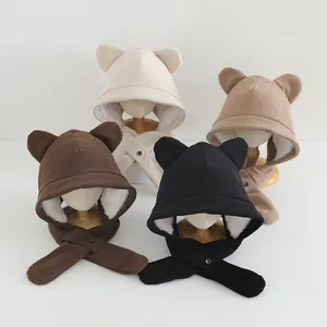 Detail of plush lamb wool lining and corduroy exterior on children's bear ear hooded scarves