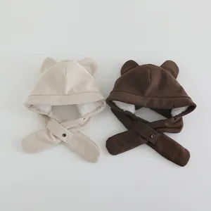 Detail of baby corduroy earmuff hats with plush lining and cute bear ear design