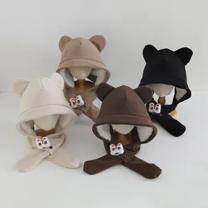 Detail of four colorful corduroy baby hats with warm fleece lining and lion applique