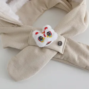 Detail of beige corduroy earflap hat with thick plush lining and lion dance embroidery
