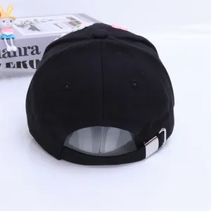 Detail of black cotton baseball cap back with silver adjustable metal buckle