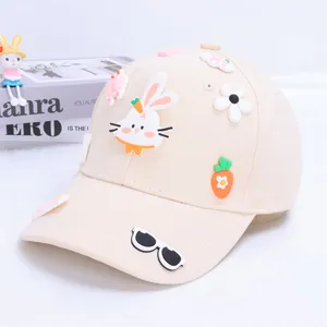 Close-up of cute 3D rabbit and carrot silicone patches on a cream baseball cap