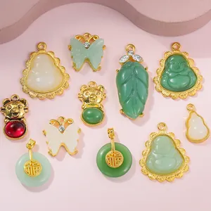 Collection of gold-plated Buddha pendants with jade-style stones and rhinestones