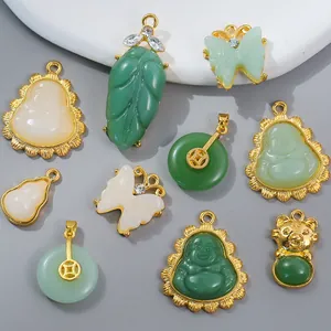 Detailed collection of gold-plated alloy pendants featuring jade-like Buddha and animal motifs
