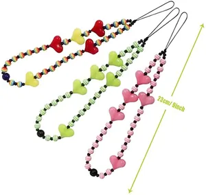 Detailed view of 23cm beaded phone charms featuring heart patterns and colorful stripes