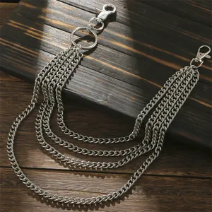 Hip-hop punk multi-layer silver metal waist chain with carabiner hooks on dark wood background