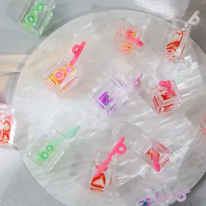 Macro shot of assorted miniature resin fruit tea charms with colorful straws for DIY crafts