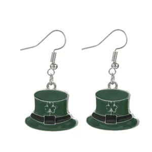 Detail view of St. Patrick's Day green leprechaun hat earrings with shamrock icon