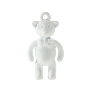 Detailed macro of a matte light blue alloy bear pendant with a 3D bow for DIY jewelry crafts