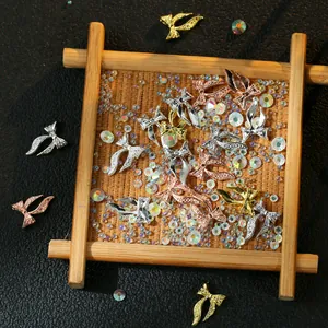 Japanese resin nail charms set featuring metallic bows and iridescent rhinestones