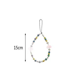 Detail showing colorful beaded phone strap with pearls and hearts, measures 15cm