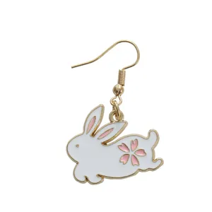 Cute white enamel bunny earring with pink cherry blossom details and gold metal hook
