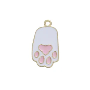 Macro view of cat paw alloy pendant with white and pink enamel for DIY jewelry making